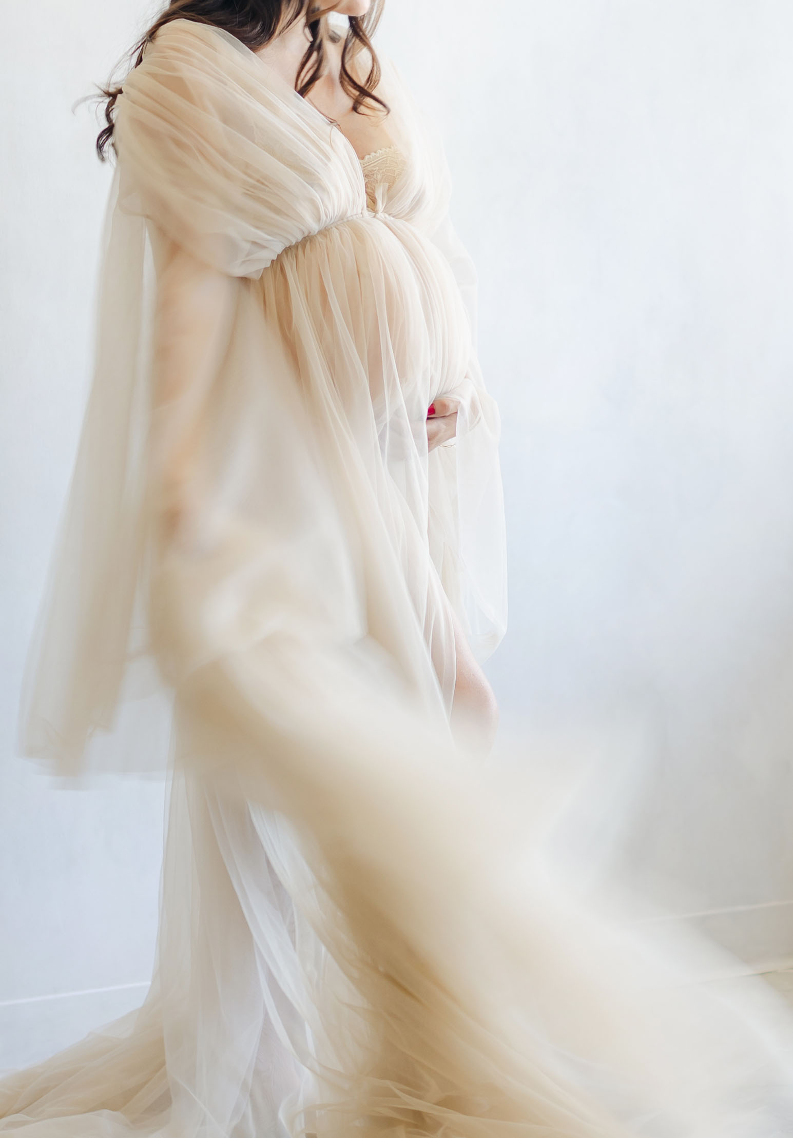 maternity photo showing motion blur in tulle gown