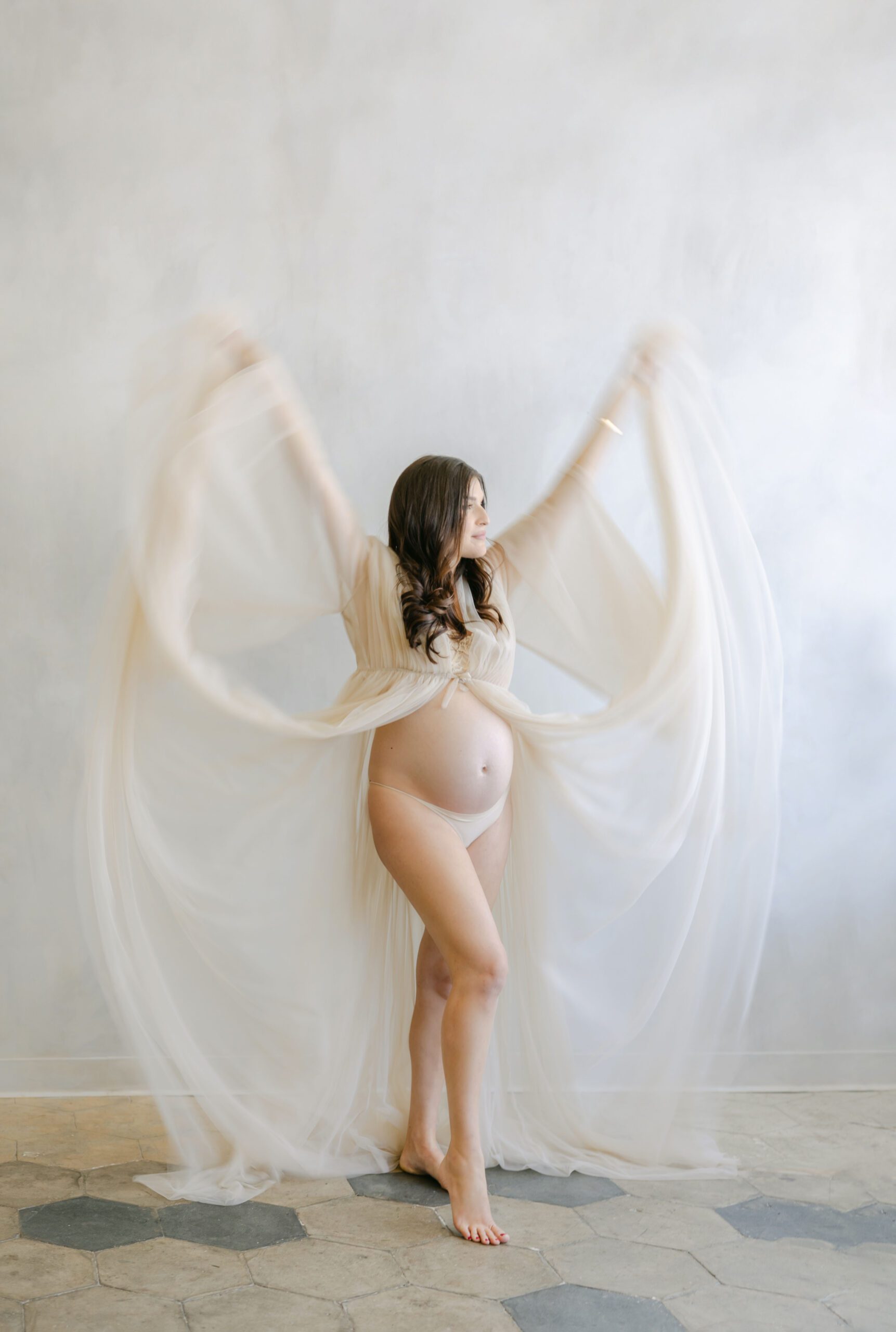 tulle gown motion blur on pregnant mom