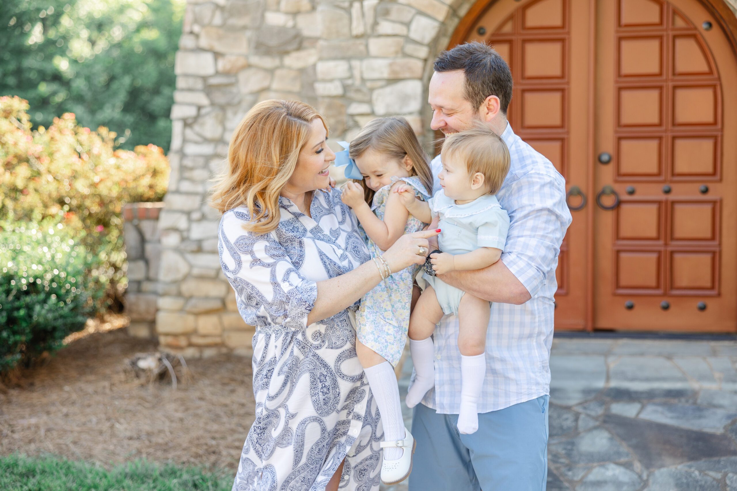 Family snuggling during their family session | Image by Chrissy Winchester Photography