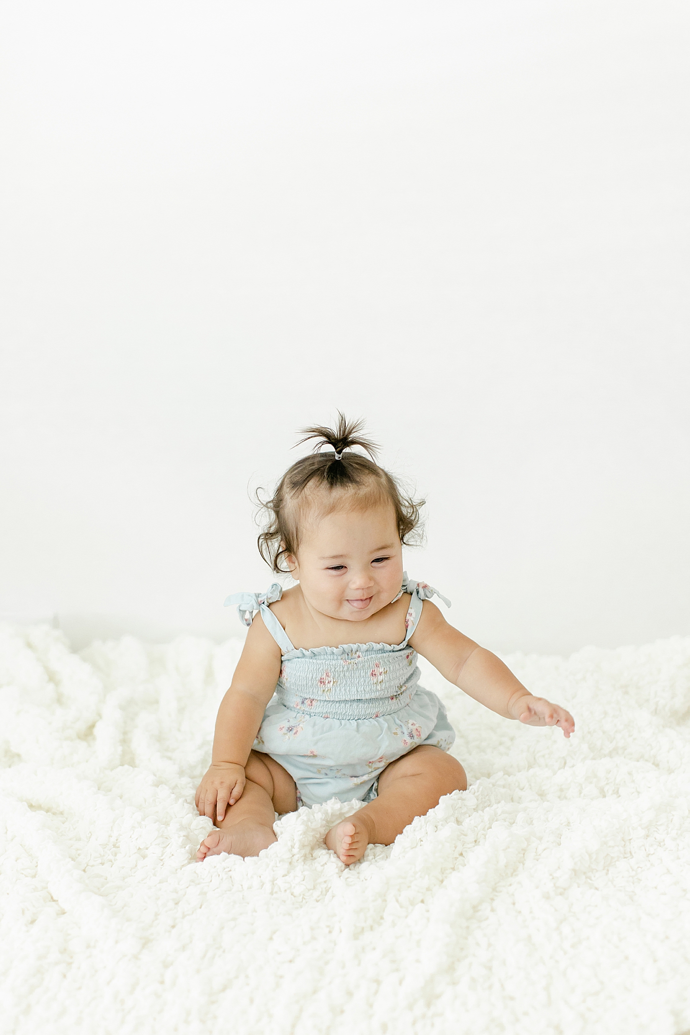 Baby girl sticking out her tongue | Image by Chrissy Winchester Photography