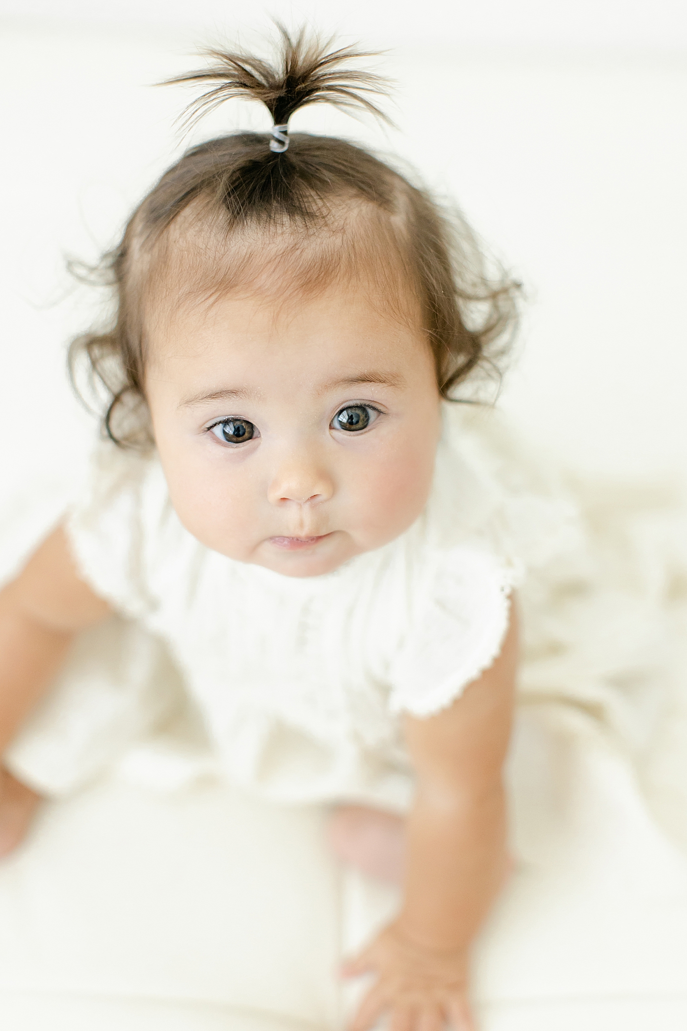 Detail of baby girl's eyes and her curls | Image by Chrissy Winchester Photography