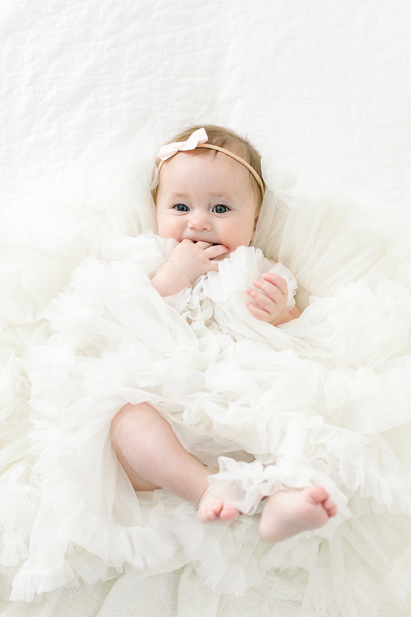 Baby girl in a pile of ruffles | image by Chrissy Winchester